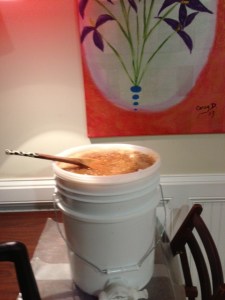 pour crushed honey and wax in filters in bucket